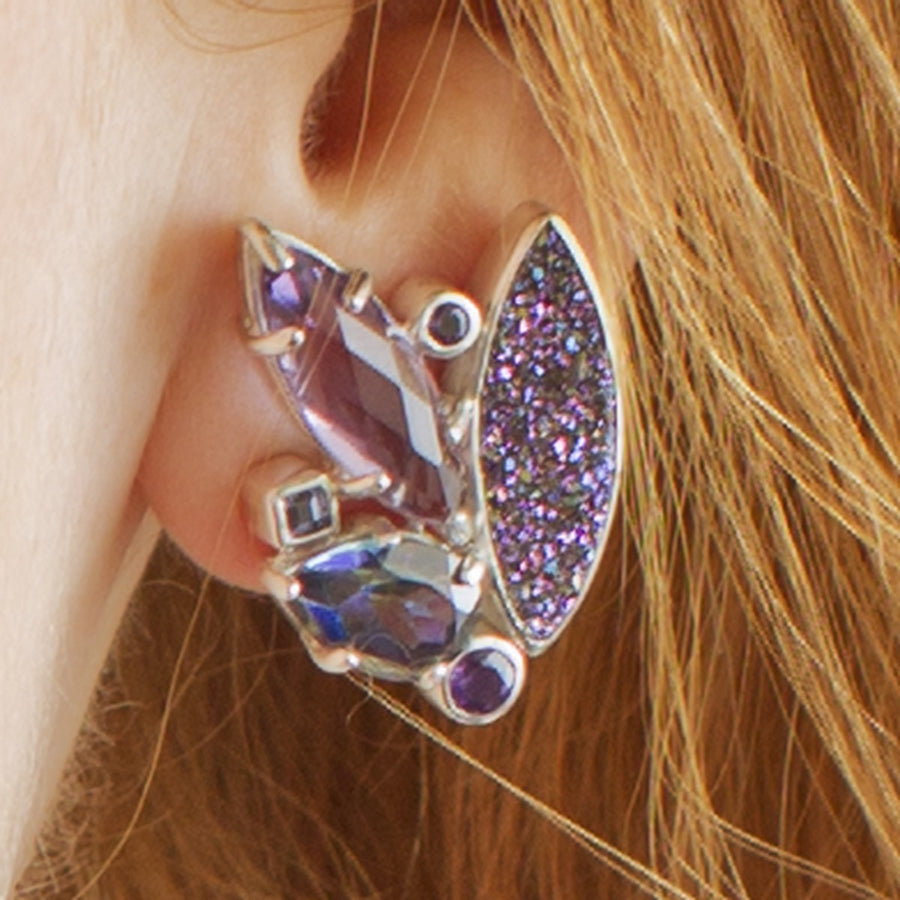 Jewelry a pair of asymmetrical silver cluster earrings featuring marquise amethyst, iridescent blue mystic topaz, and sparkling purple druzy