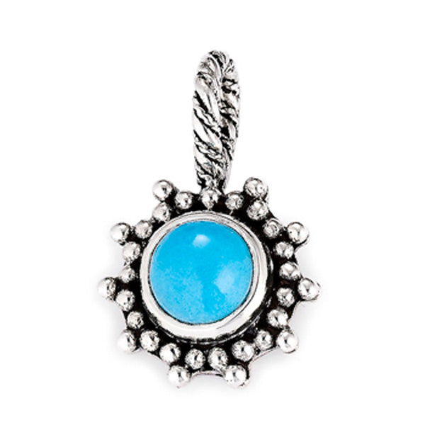 Silver pendant featuring a sky-blue round turquoise stone set in a sun-shaped silver frame with small beaded accents and a twisted bail