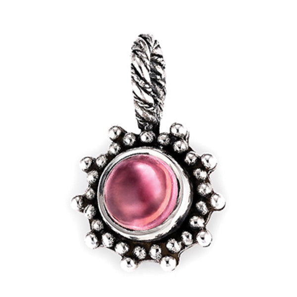Sterling silver pendant featuring a vibrant pink round cabochon stone surrounded by an antiqued granulated edge and topped with a twisted bail