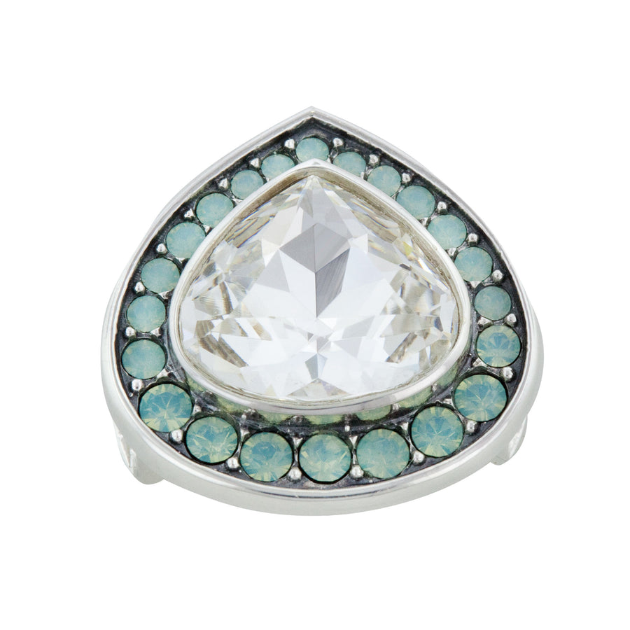Product photography of a silver-toned tear-drop shaped jewelry snap with a large central clear faceted crystal surrounded by smaller round light blue opal-like crystals